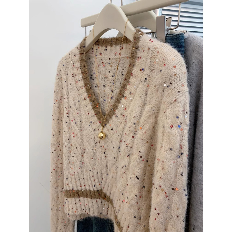 Mujeres coreanas envejecen y cuello alto único manteniendo cálido suéter casual suéter de diseño de otoño y invierno sensación de nicho camiseta de punto
