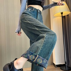 ハイウエストの青いワイドジーンズの女性の春の新型のゆったりしていて、やせて見えるデザイン感があります。
