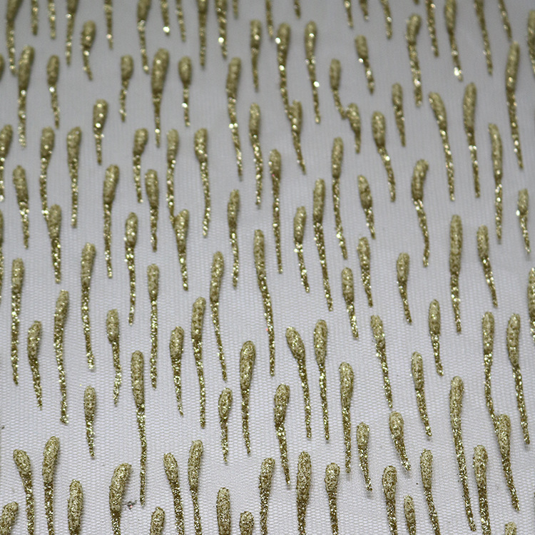 Inventario de tela de malla de moda lluvia oro rociado tela espumosa primavera-verano vestido de moda tela de niña
