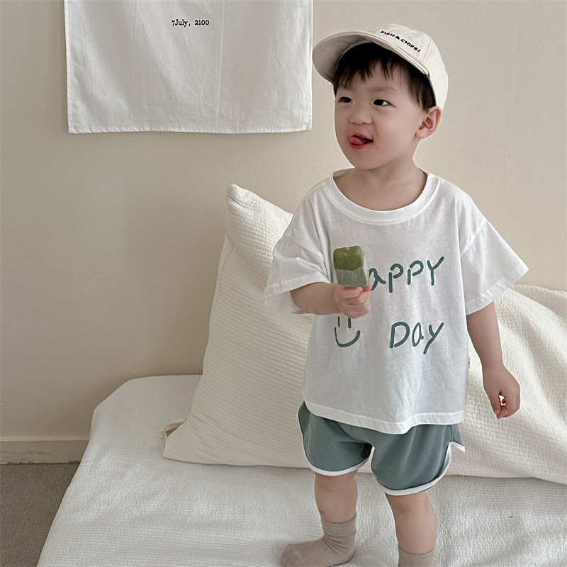 Traje de pantalones cortos de manga corta para niños, ropa de verano para niños, estilo delgado, ropa para niños coreanos, traje de sonrisa de letras de verano para bebés