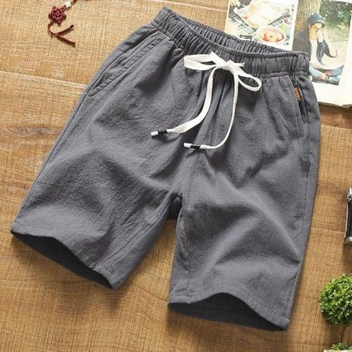 Pantalones cortos casuales pantalones finos de cinco puntos de algodón y lino para hombre, pantalones sueltos de color sólido, pantalones de todo fósforo, estilo coreano, hermosos pantalones cortos de playa, marea