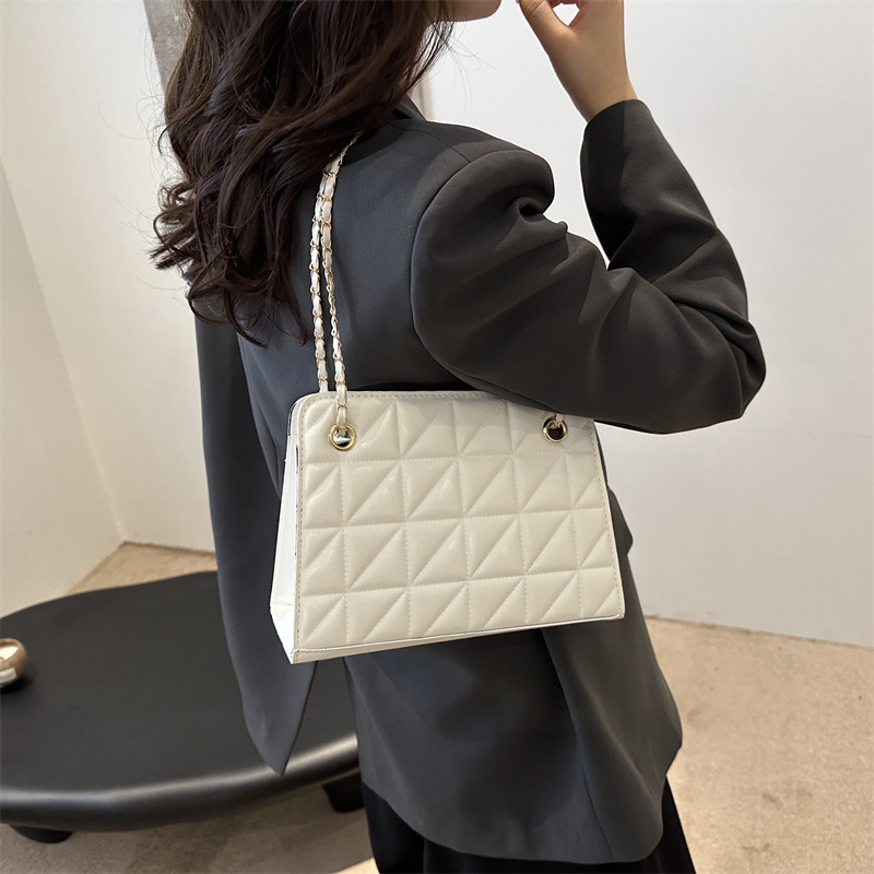 Este año, la popularidad de la bolsa 2024 nueva moda de verano, bolso de hombro, nicho de alta calidad, bolso de hombro universal