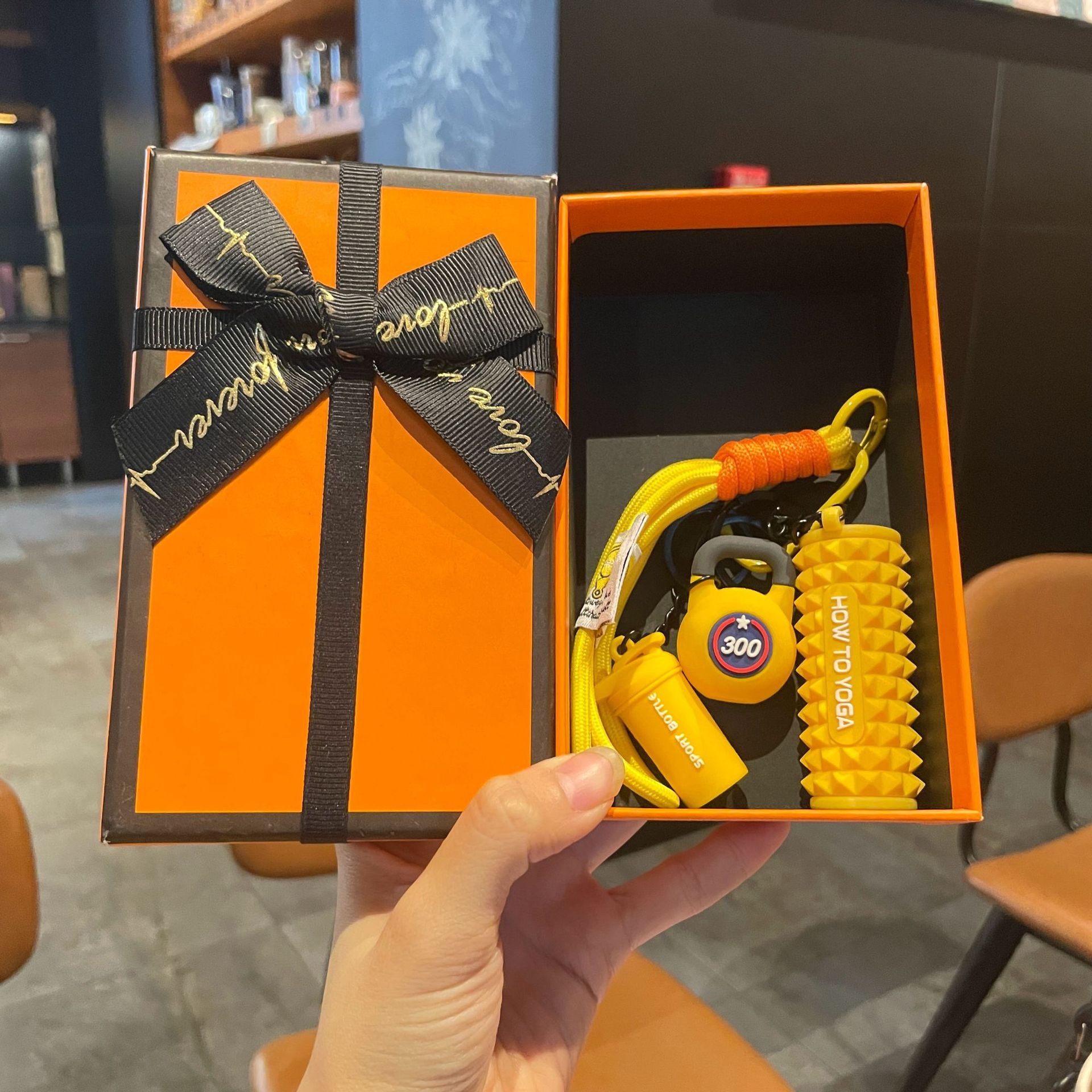 Yellow set for yoga from foam, orange gift box
