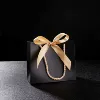 Black bag, golden handheld hair band