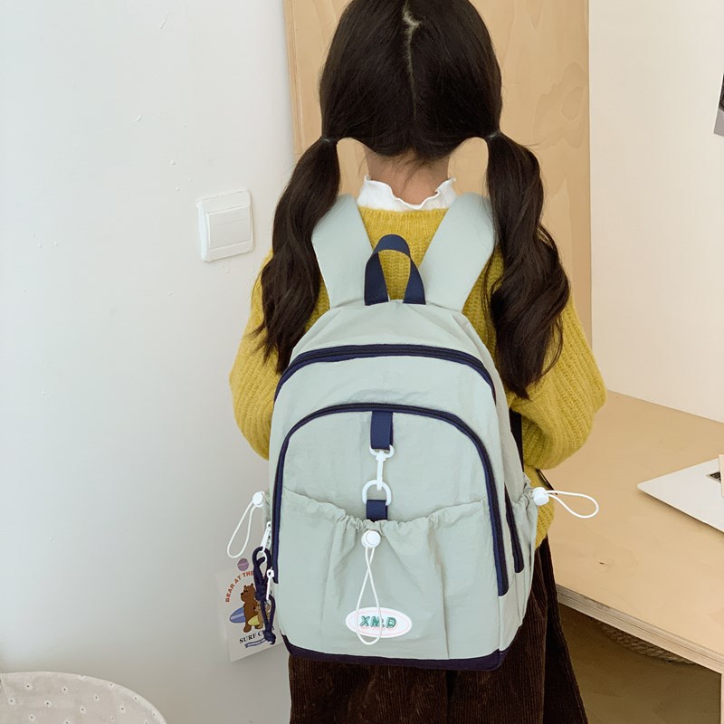 Coreana simple color sólido mochila de niños y niñas de gran capacidad mochila escolar 2026 nueva mochila de niños de cuerda