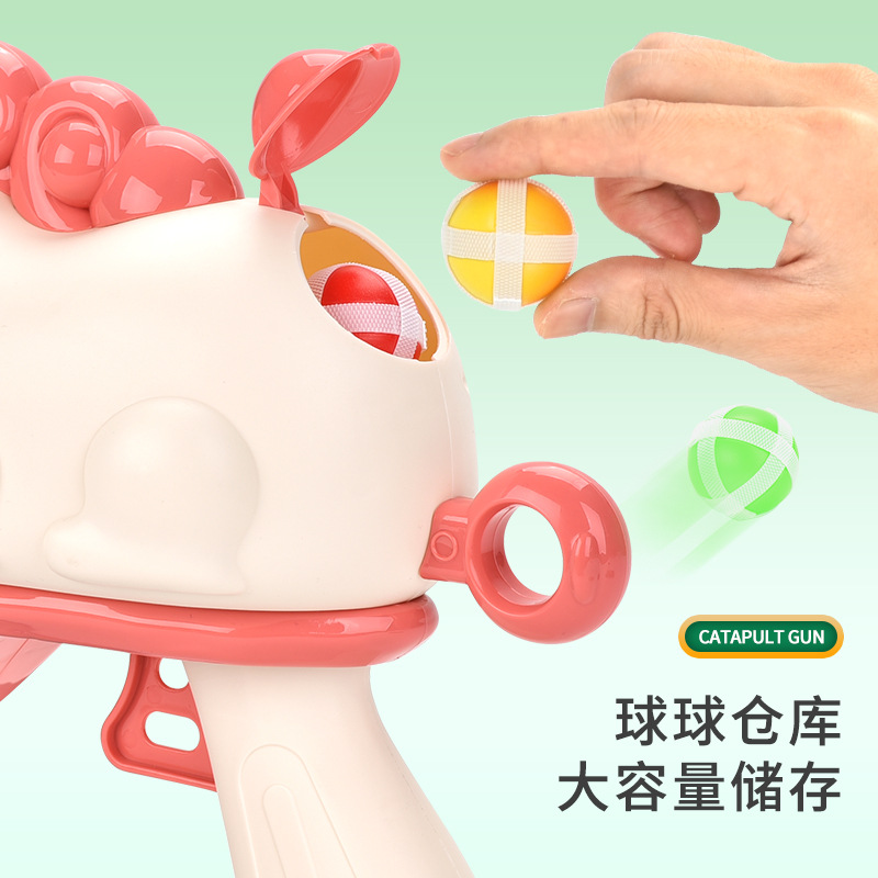 Interacción padre-hijo dibujos animados modelo de bolas de dinosaurio juguetes para niños bolas pegajosas pistola de catapulta puesta en barracas juguetes transfronterizos