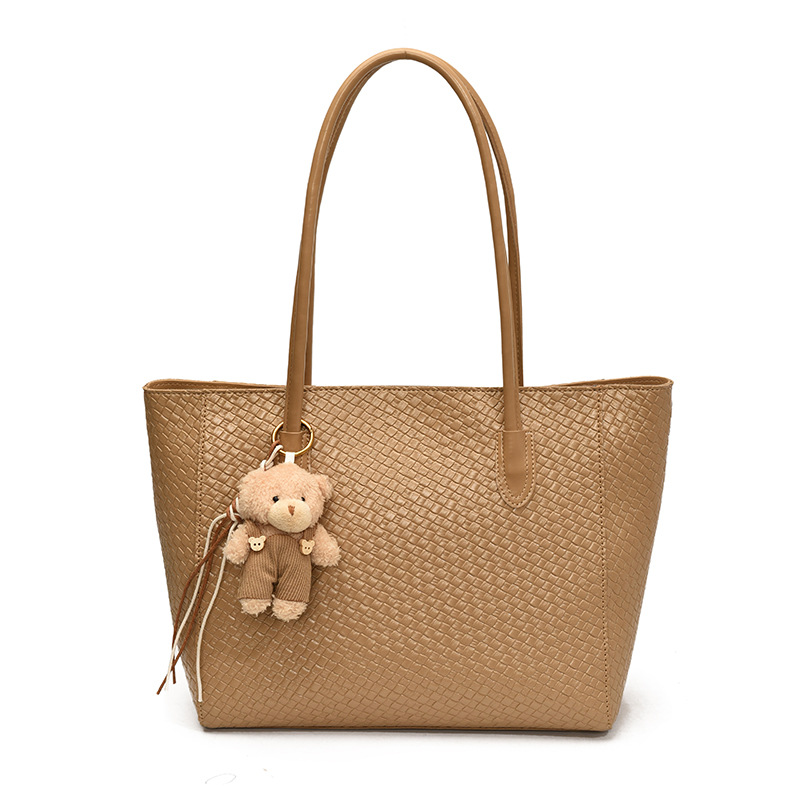 Bolsa de moda retro de gran capacidad para mujeres 2025 nueva bolsa de hombro transfronteriza simple textura casual bolso de abrigo
