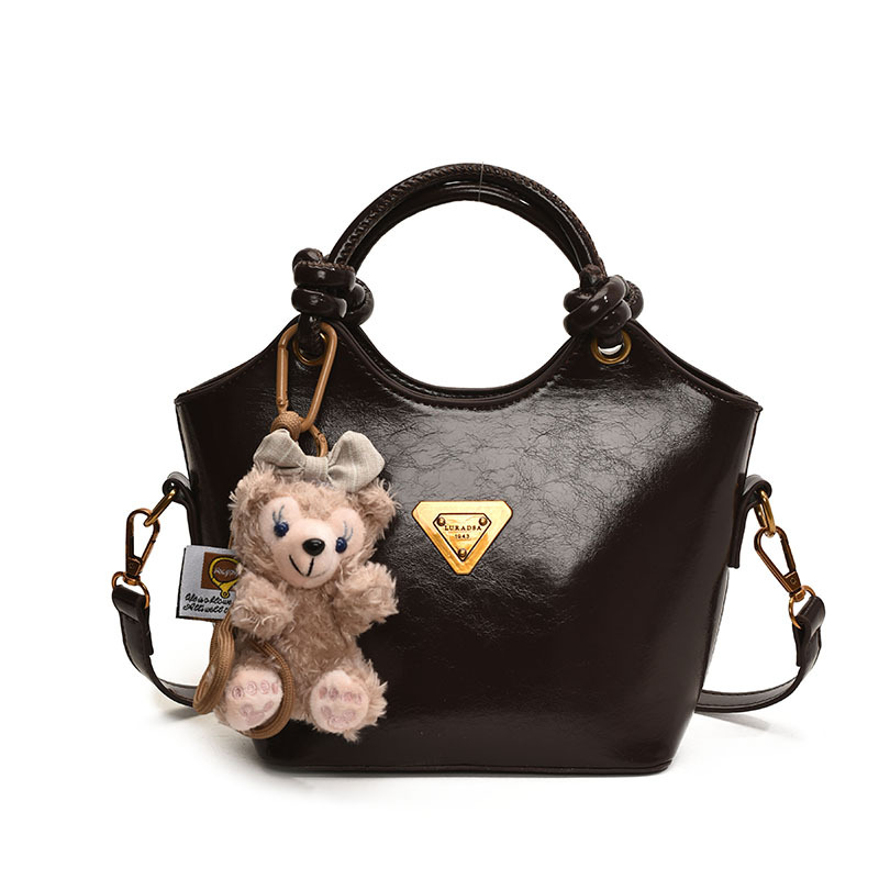 Bolsa de cubo de moda coreana retro primavera y verano nueva moda bolso de hombro de estilo de moda para trabajar textura personalidad mochila