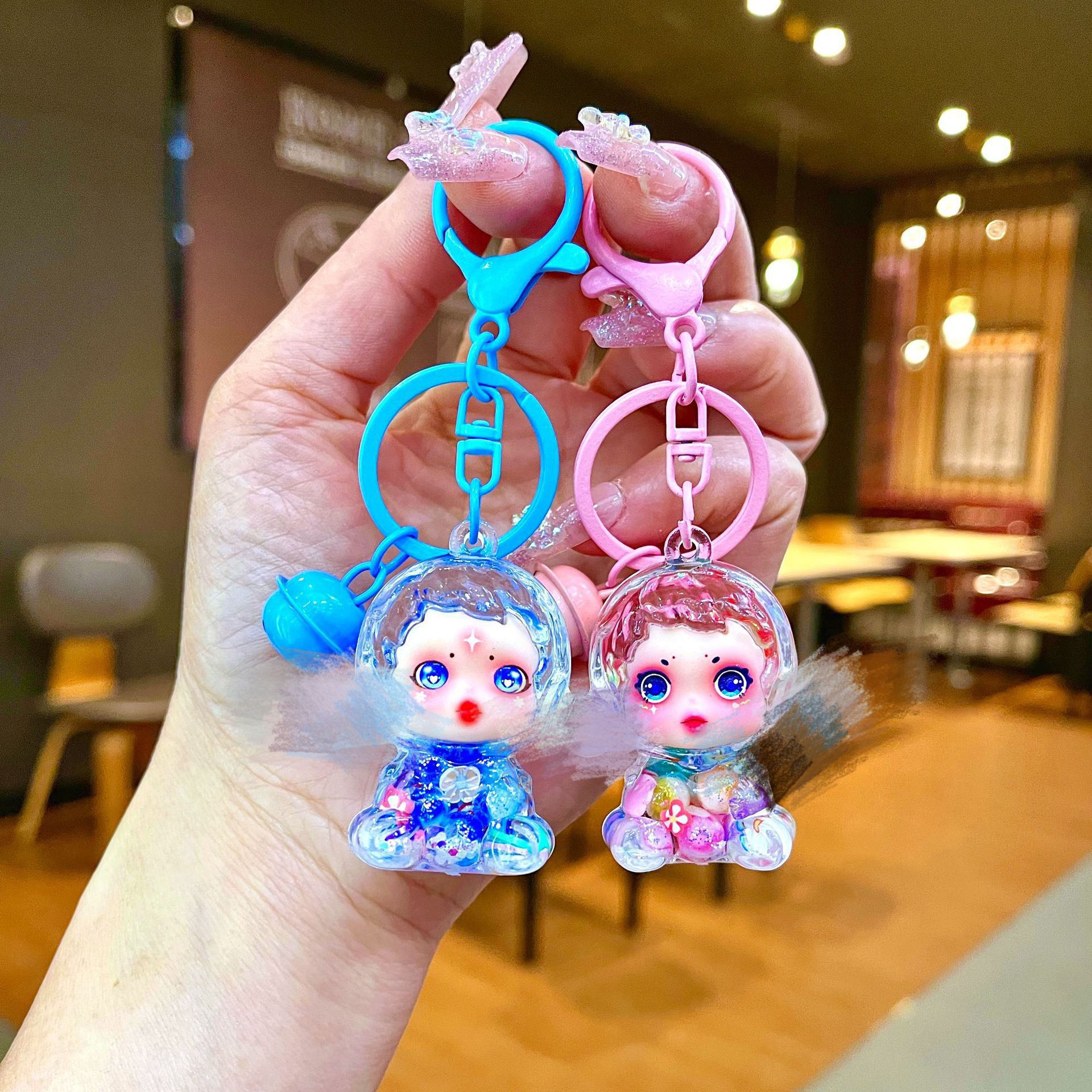 La nueva muñeca de la burbuja intermitente, llavero de arena movediza aceitosa, adornos luminosos, caja ciega de Douyin, adornos de escritorio