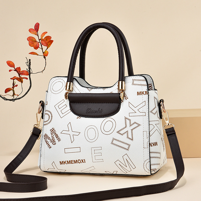 2024 fabricantes bolsos de mano de gran capacidad bolsos de mujer retro versátil bolsos de hombro texturas bolsos de tendencia