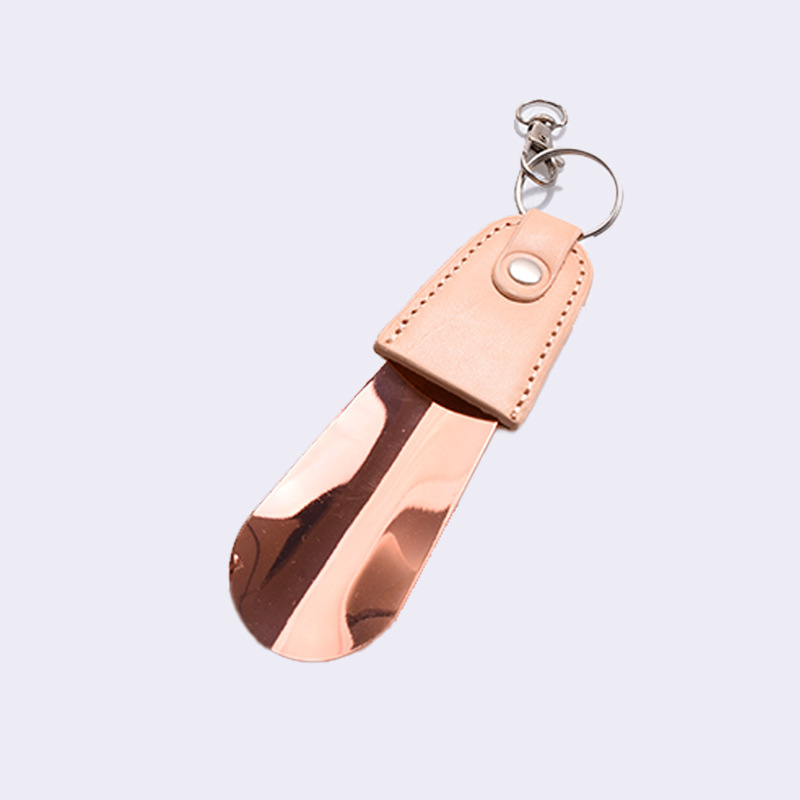 Inventario al por mayor de acero inoxidable llaver de zapato de tirador de cuero funda de zapato portátil de tirador de zapato de coche llave colgante elevador de zapato