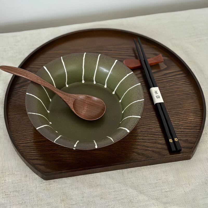 Rustic Japanese-style tableware, including plates, serving dishes, and bowls for rice, fruit, and soup, with a sophisticated and vintage design for home use