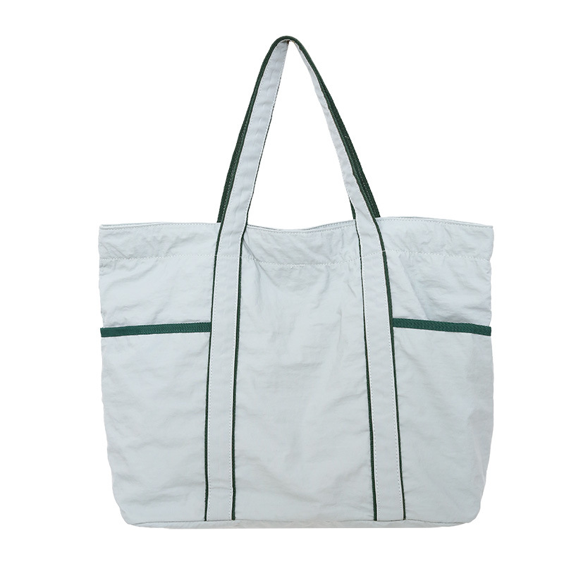 Bolsa de mano de tela de nylon de gran capacidad para mujeres 2026 nueva simple, ligera y versátil bolso de hombro de viaje diario