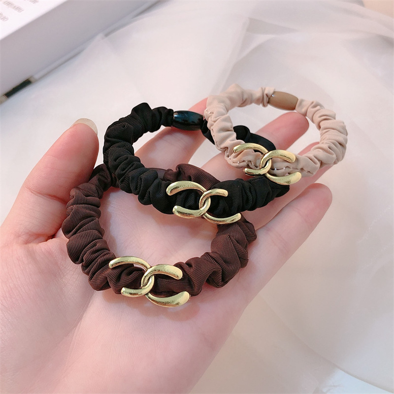 aleación de moda intestino delgado cabello anillo de cabeza cuerda de mujer temperamento simple atar joyas de cabello nuevo estilo de alta sensación simple joyas de cabello cuerda