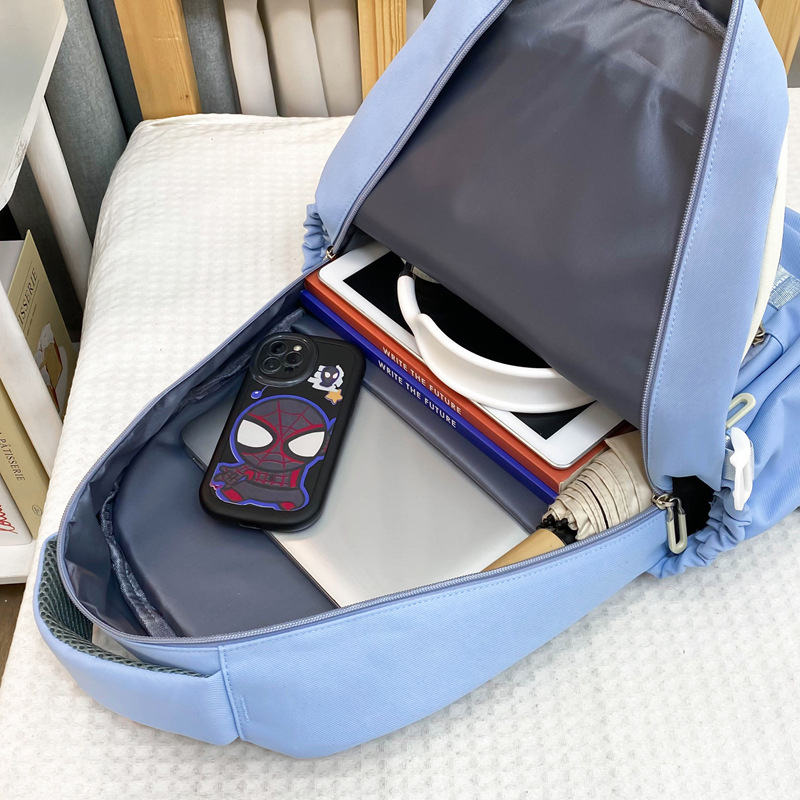 Mayorista nueva mochila de gran capacidad de moda simple campus mochila escolar de tendencia de carga mochila de viaje