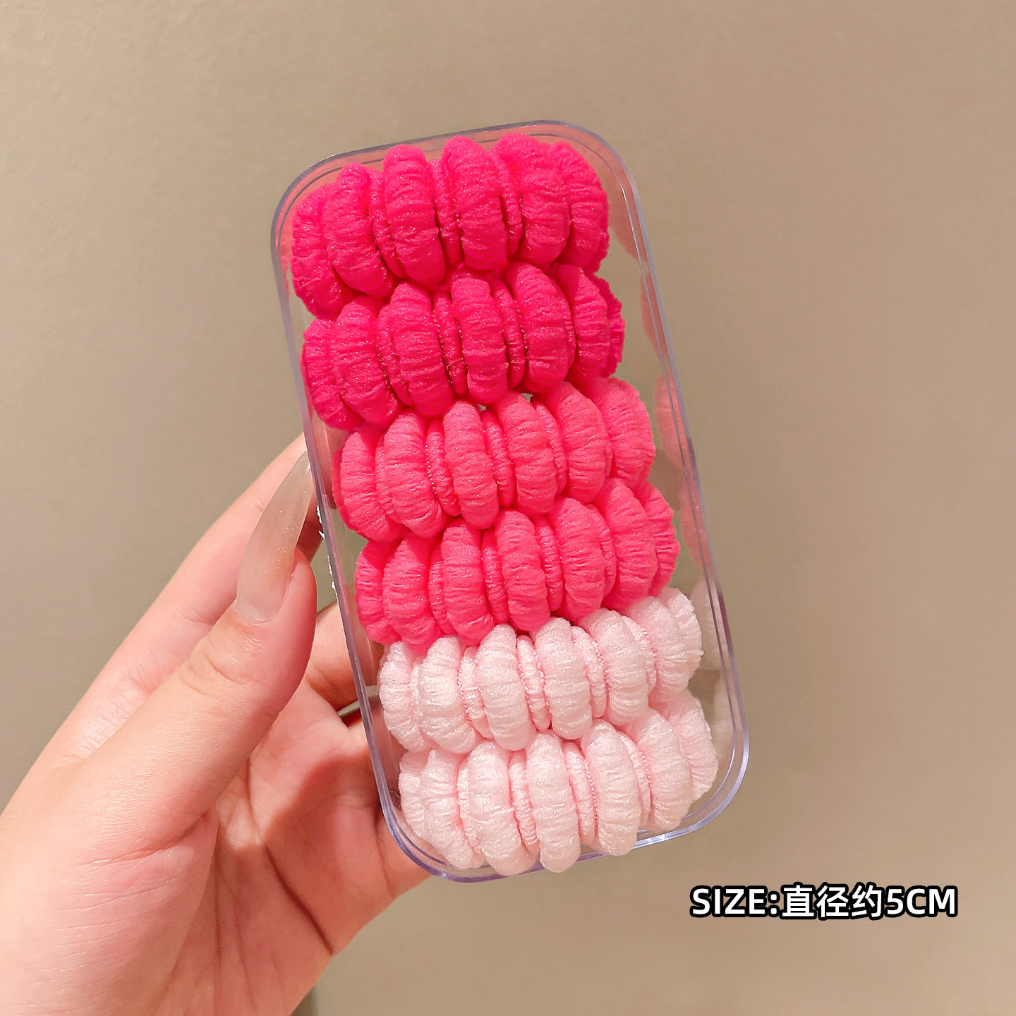 Goma elástica de lana rosa.