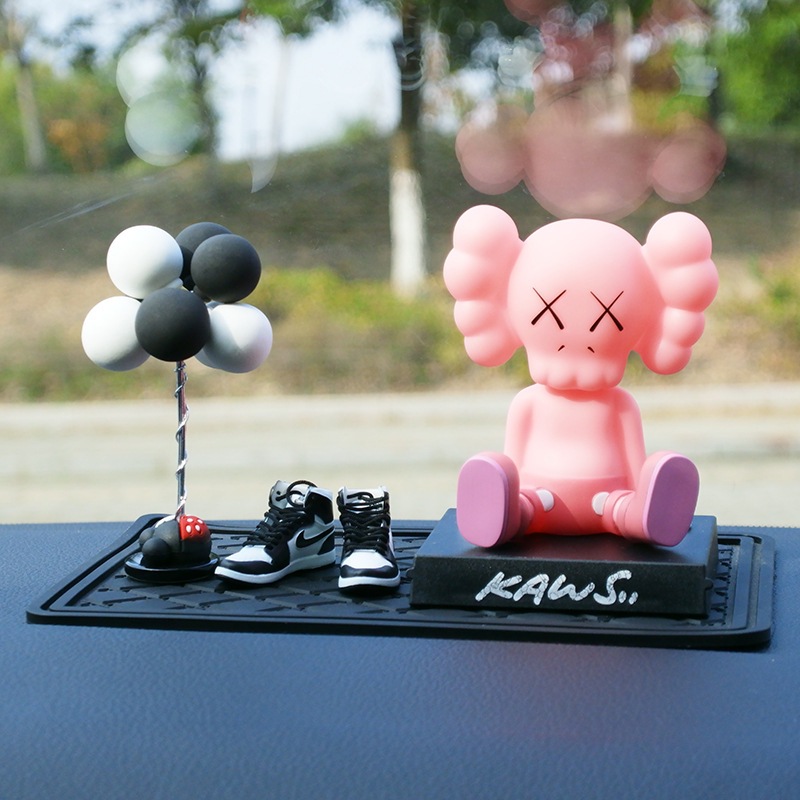 Pink kaus + black and white balls + black and white shoes + small grid mat