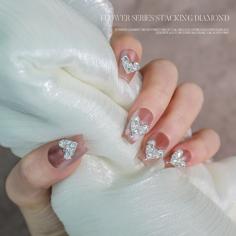 Love bowknot aleación manicura pila de diamantes productos terminados celebridades de Internet nuevas decoraciones de uñas de diamantes de pila súper flash al por mayor