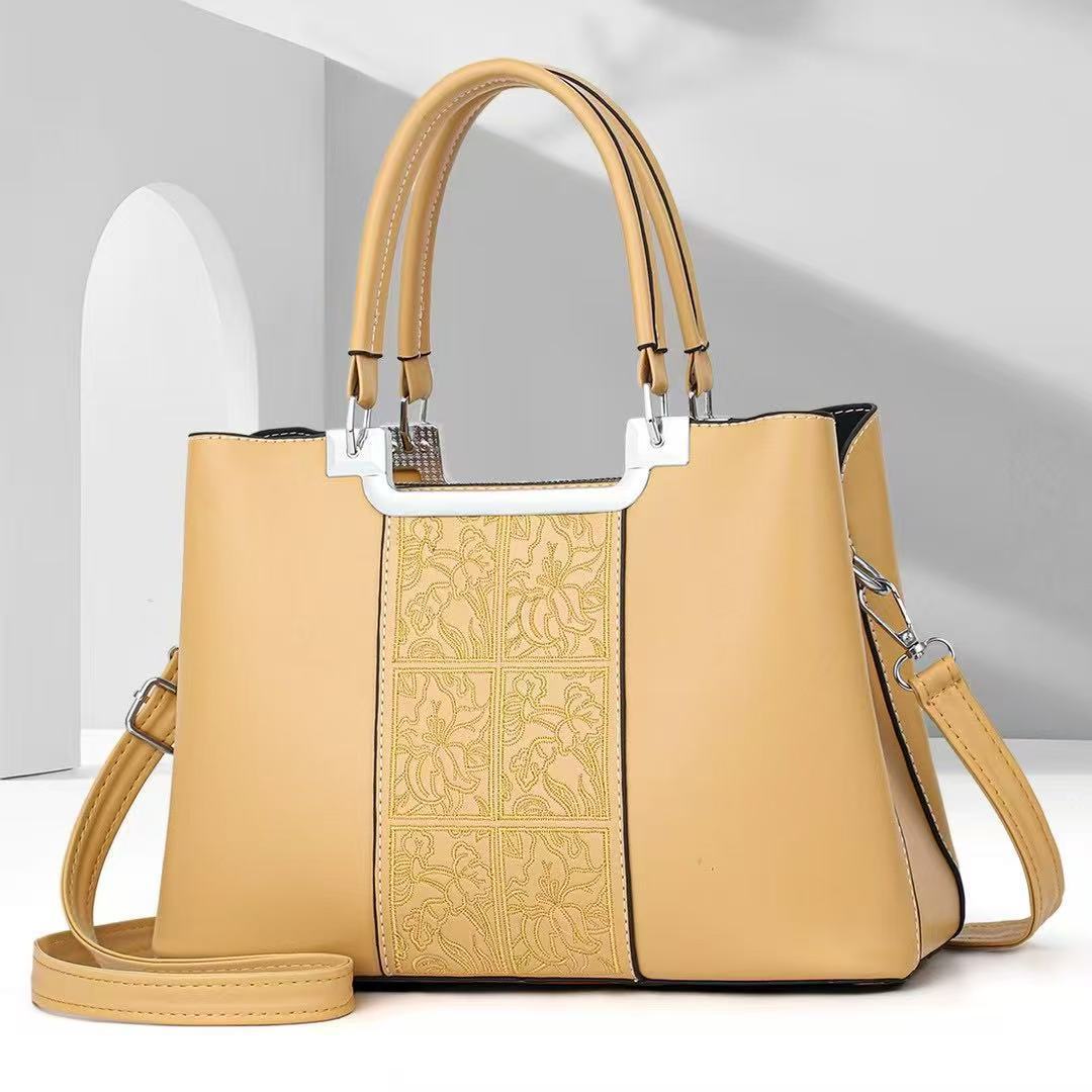 Bolso de madre atmosférico bolso de mujer simple de gran capacidad bolso de mensajero de hombro estilo explosivo bolso de marca de moda 2025
