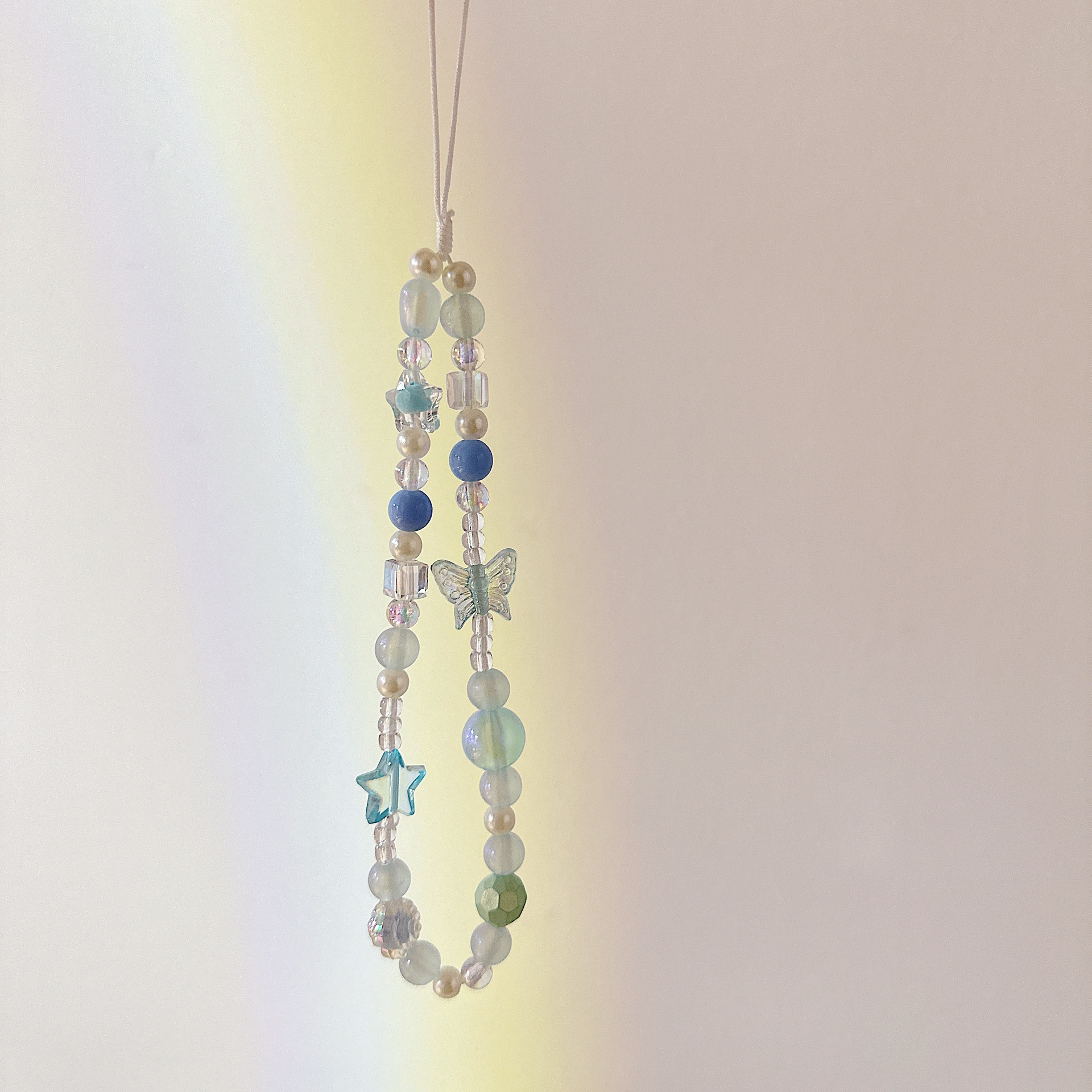 Cadena aplicable nicho mariposa corta cadena de muñeca arco cuentas de caso de teléfono móvil colgante tipo correa de muñeca anti-pérdida