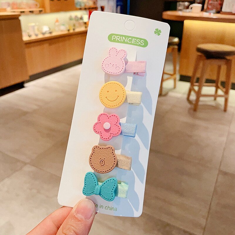 Hermosos clips de cabello de color para niños coreanos de alto nivel sensación de arco de niñas bolsa de tela no daña clips de cabello de bebé
