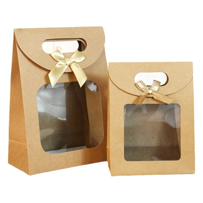 Bolsa de embalaje transparente de la ventana del arco del tirón en stock bolso al por mayor bolsa de papel de embalaje de regalo bolsa de regalo grande