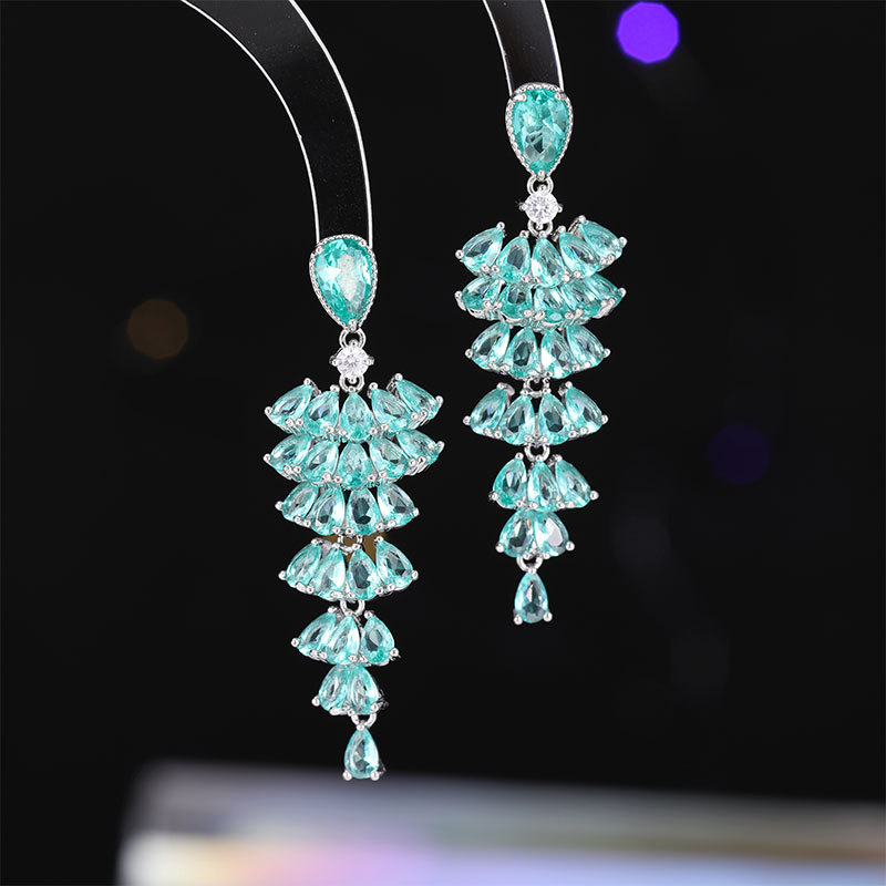 Fashionable long earrings with tassels drop-shaped with zircon