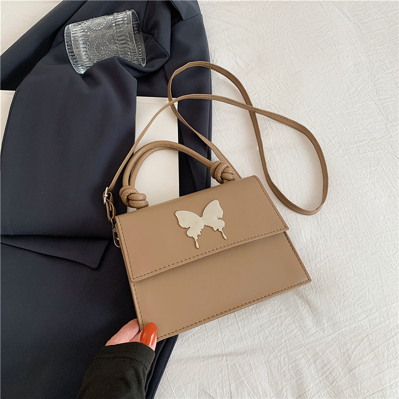 Diseño de nicho de lujo ligero bolso de mano de este año popular arco decoración de viaje diario mochila de hombro para mujeres