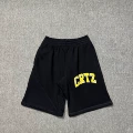823 black and yellow shorts