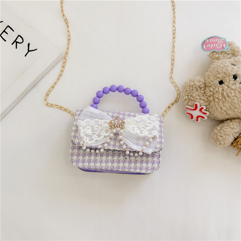 2024 nueva moda lindas bolsas de hombro para niños bolsas de perlas a cuadrícula bolsas extranjeras bolsas de hombro para niñas gran capacidad marea