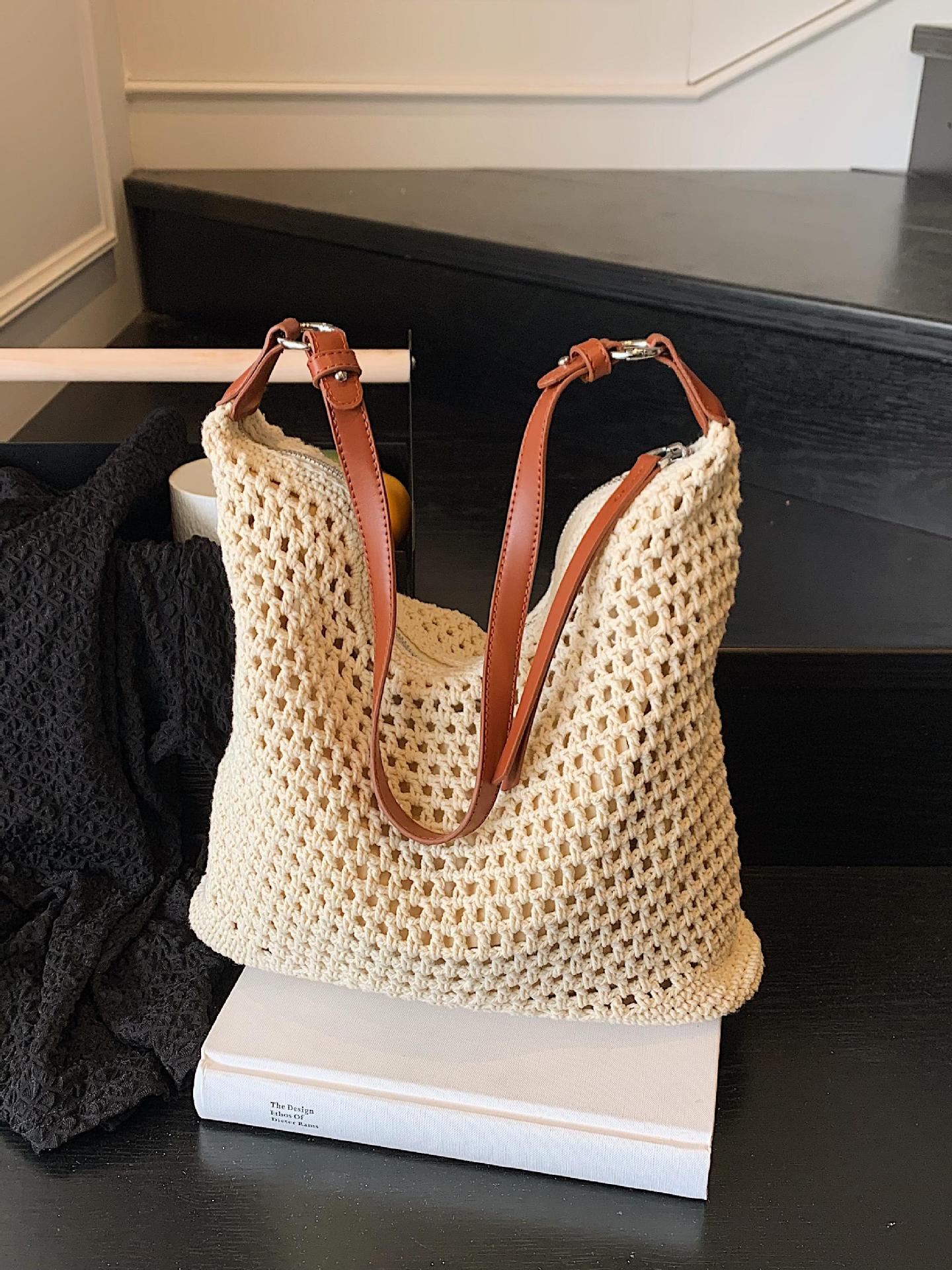 Venta caliente de verano nuevo producto bolsa tejida hueca para mujer 2025 bolsa de playa estilo vacaciones bolsa de paja de gran capacidad bolsa de cubo