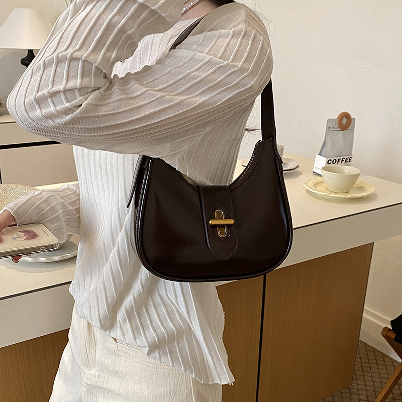Bolso de brazo de moda de alto nivel, bolso de hombro de alta calidad, nuevo estilo de mujer 2026 simple, bolso de hombro de alta calidad, bolso de transporte universal.