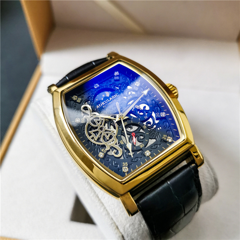 Barril de vino Reloj mecánico automático hueco-hacia fuera transparente azul claro vidrio luminoso de cuero impermeable de los hombres hebilla de mariposa Mesa multifunción