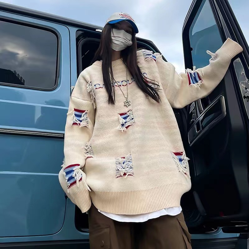 欧版新款秋冬中长款大版针织时尚破洞女套头不规则流须设计毛衣