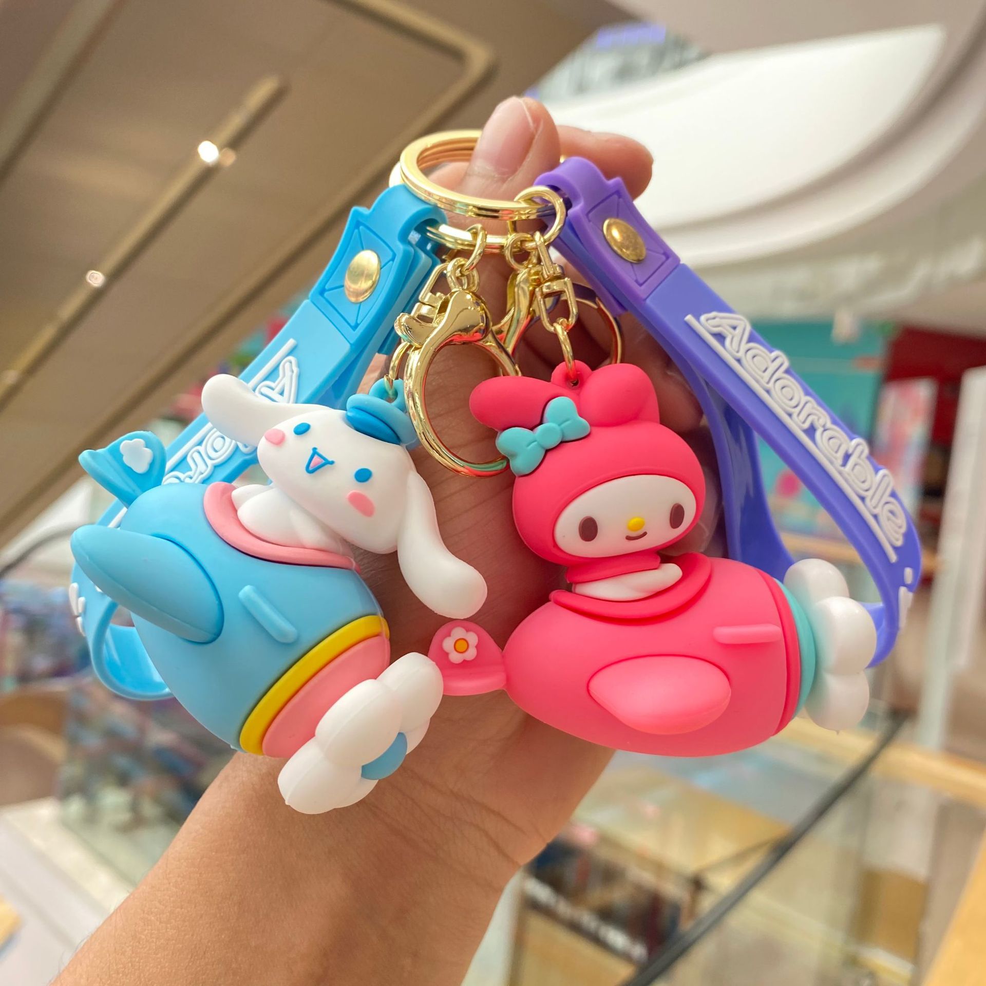 Creativo de dibujos animados Sanrio giratoria dulce avión llavero coolomi muñeca llavero pequeño regalo al por mayor