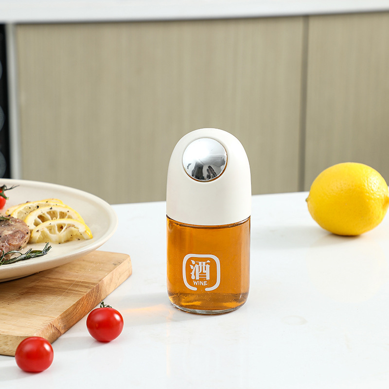 La nueva olla de aceite de vidrio de apertura y cierre automático, botella de condimento de cocina para el hogar, mayor capacidad, boquilla de aceite en forma de gota, tanque de vinagre de salsa de soja