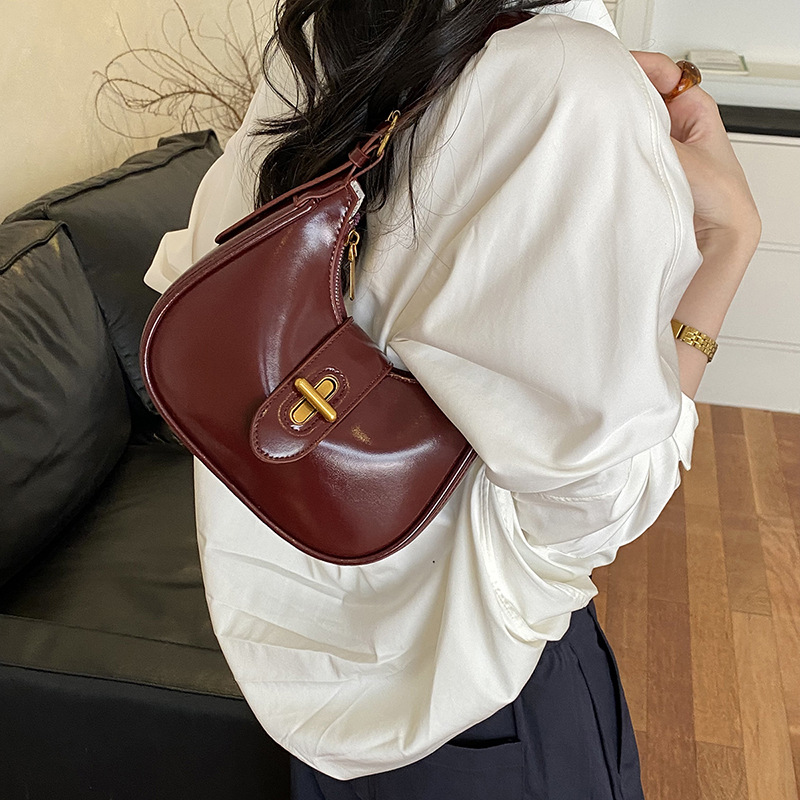 Bolso de brazo de moda de alto nivel, bolso de hombro de alta calidad, nuevo estilo de mujer 2026 simple, bolso de hombro de alta calidad, bolso de transporte universal.
