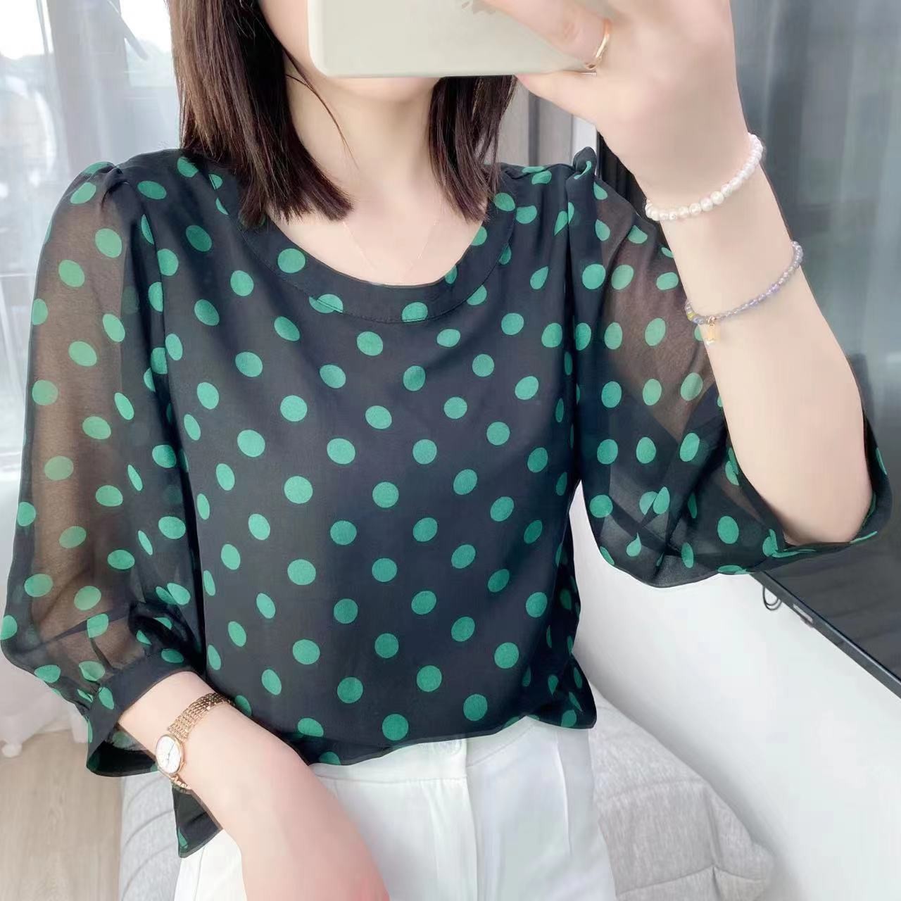 The new summer round-neck polka dot stylish and youthful chic top for women. The new summer design is a loose half-sleeved shirt pic 1