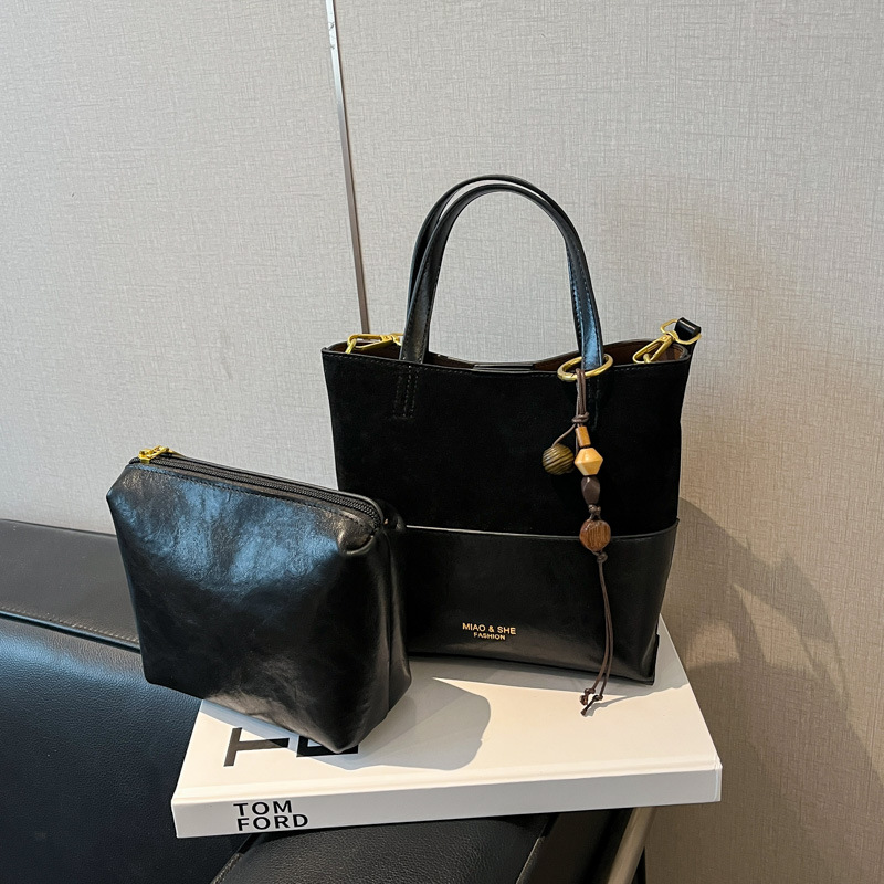 Bolsa de color retro de estilo extranjero para mujeres otoño y invierno 2025, nuevo tipo de bolso de hombro de viaje, bolso de cubo de mano de alta calidad