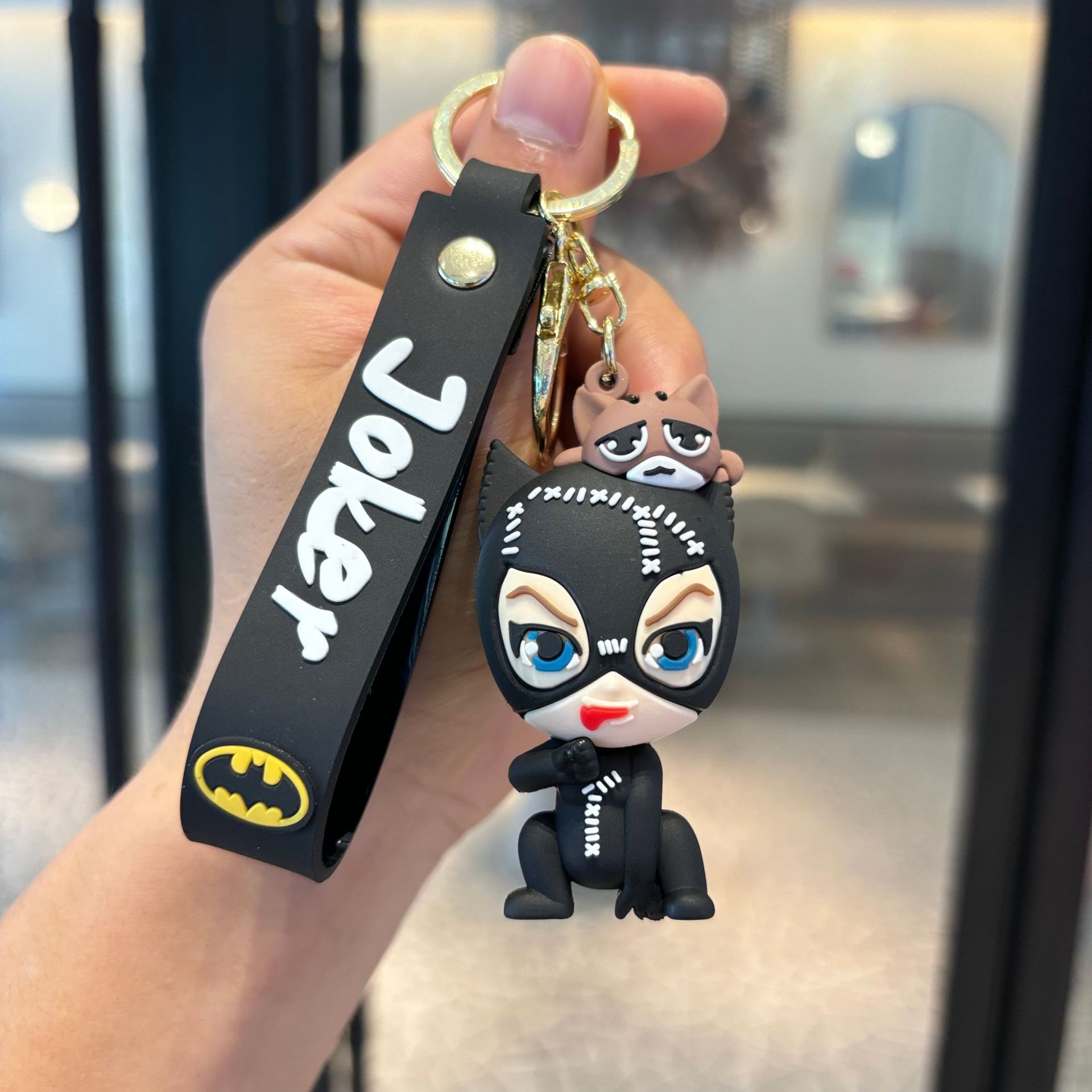 Batman cruzado superhéroes clown muñeca coche llavero colgante muñeca máquina de regalo pequeño