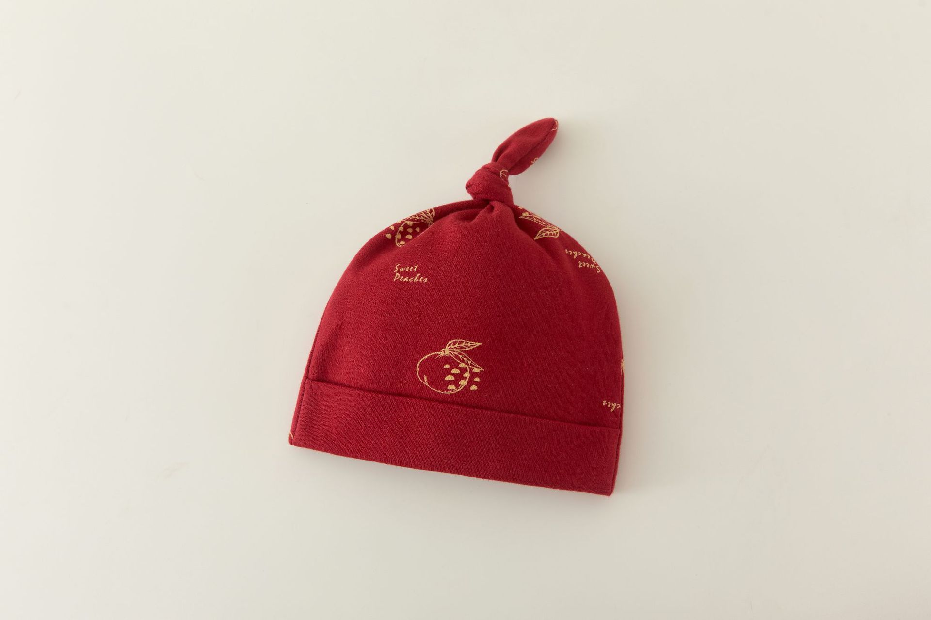 Red pomegranate hat