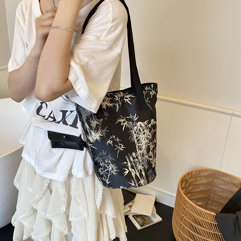 Nuevo bolso de cubo chino 2025 nuevo bolso femenino de seda bolso de bambú de estilo nacional bolso de hombro de caqui de alta calidad marea