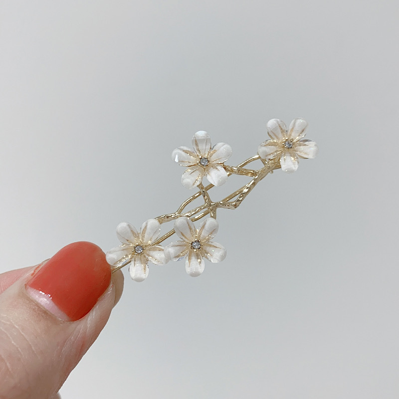 Elegante haarspeld met kattenoogsteen en bloemendesign_voghion.com