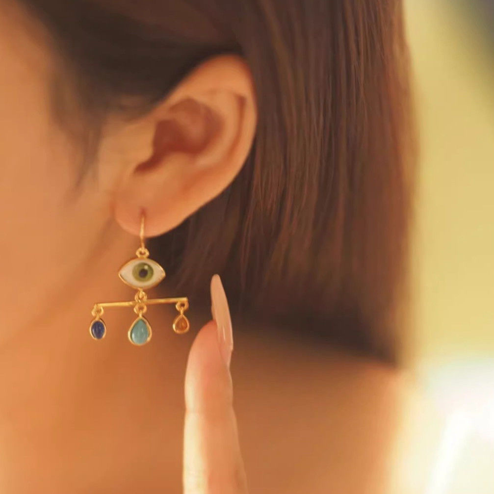 Cross-border bohemian eyeball earrings pendant artificial blue turquoise European and American style niche balance seat tassel ear hook female