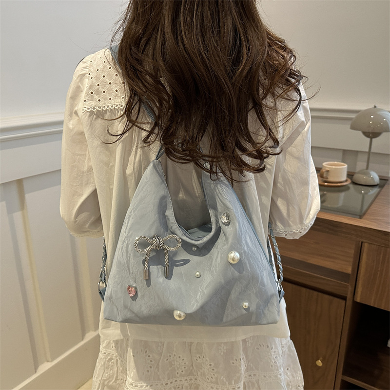 Mochila de diseño de nicho, mochila de hombro, mochila multipropósito, bolsas de cadena de alta capacidad.