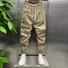 2023春季新款男休闲裤排扣束脚工装裤潮牌拼接纯色宽松哈伦小脚裤