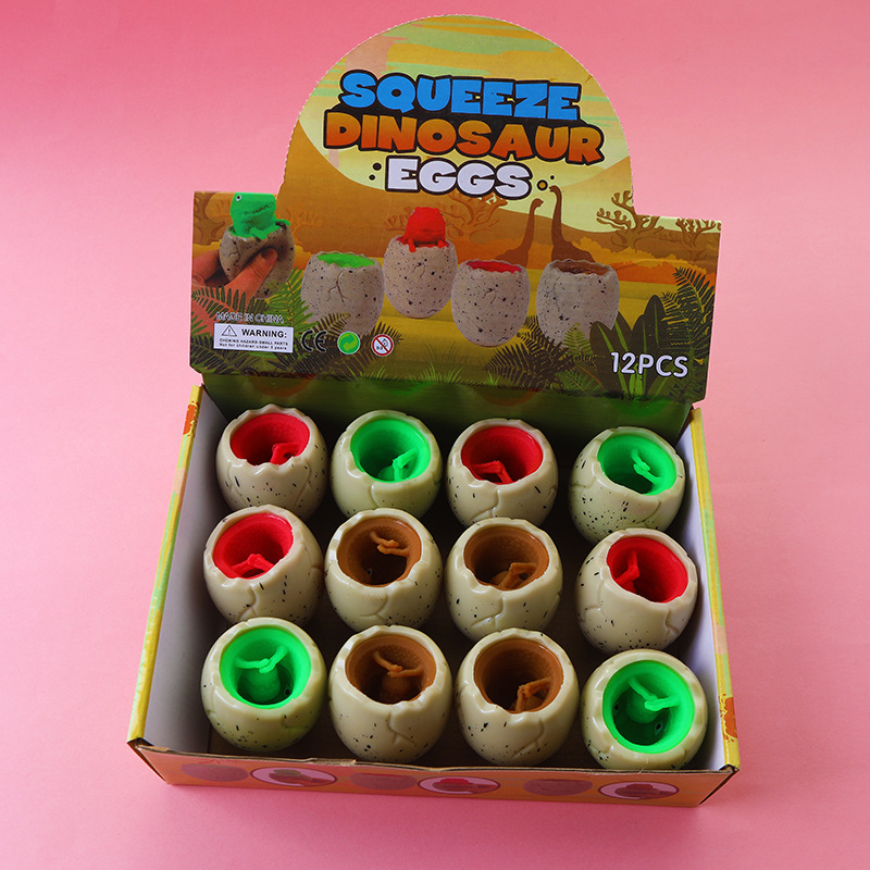 Red famosa novedad huevo de dinosaurio extruido juguete taza de dinosaurio para niños pellizco pellizco de escape bola de escape pegamento suave huevo