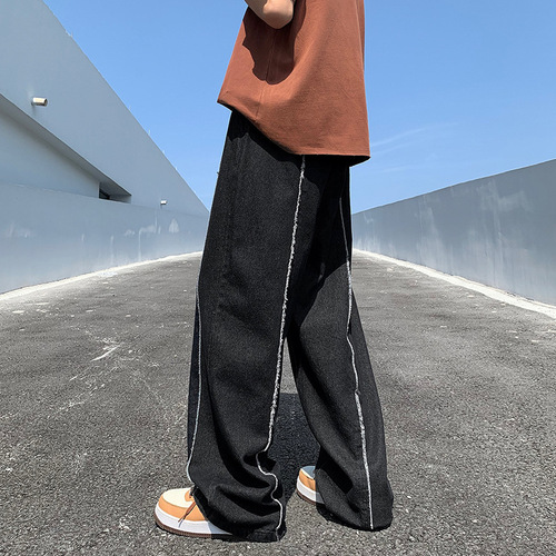 Yellowish-brown wool denim jeans for men, featuring a high-street vibe and an American-style trendy brand design—summer edition, effortlessly cool, with a relaxed, loose fit and straight, wide-leg silhouette.