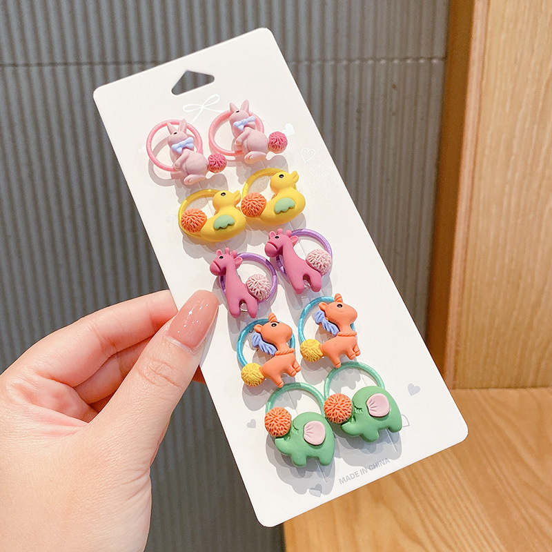 Los niños de la banda del pelo del bebé de la historieta no lastiman la banda de goma del pelo de la niña volumen del pelo menos cuerda del pelo del bebé