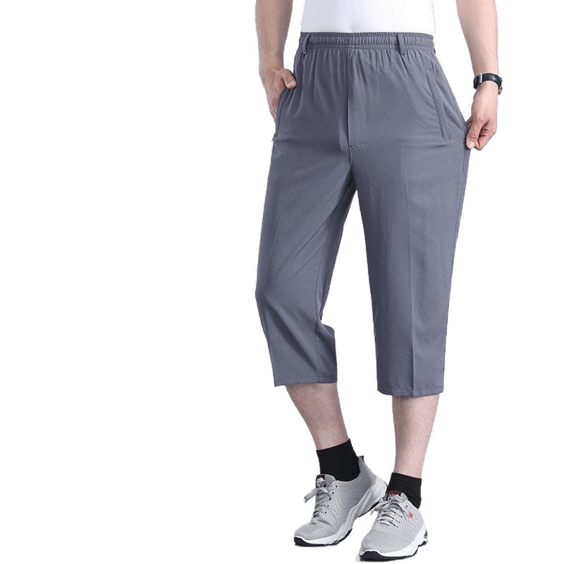 Pantalones de secado rápido de seda de hielo para hombres delgados cintura elástica de cintura media de 8 puntos pantalones cortos de mediana edad, jóvenes y delgados pantalones transpirables